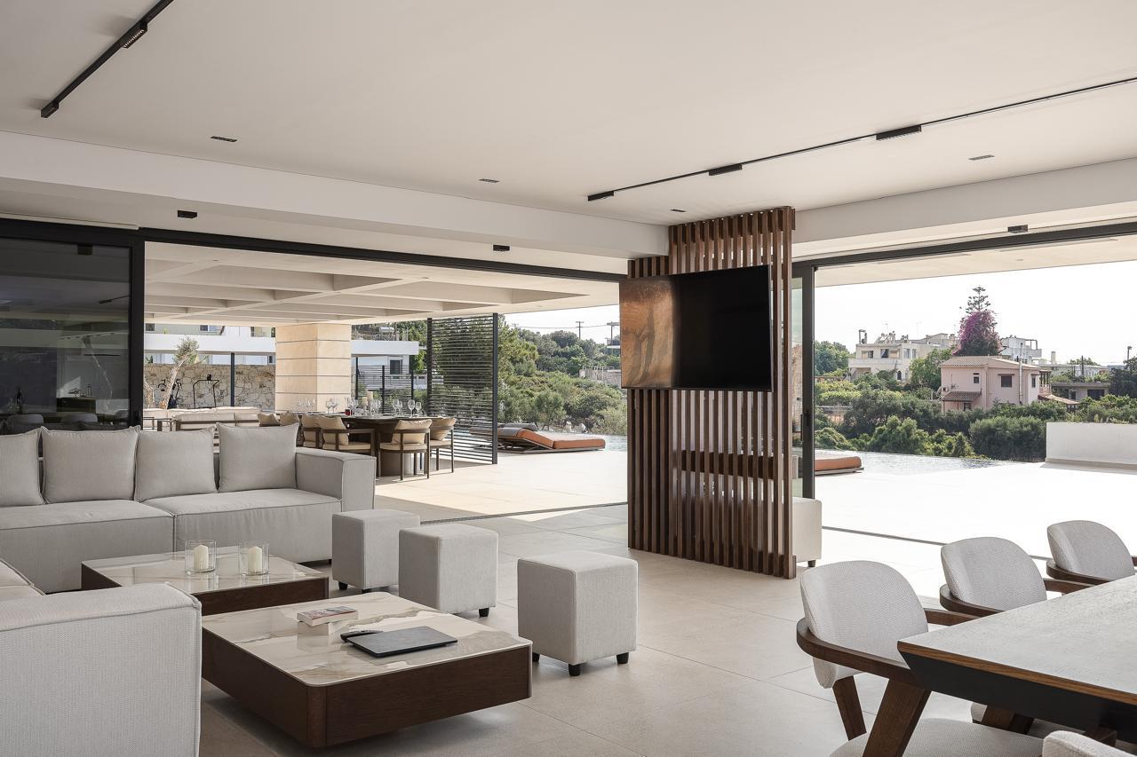Villa KORA living room opening directly to the terrace and pool