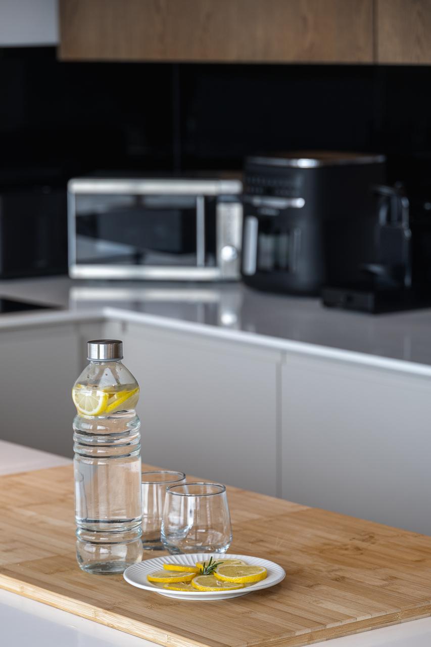 Water and fresh lemon set out on the kitchen island