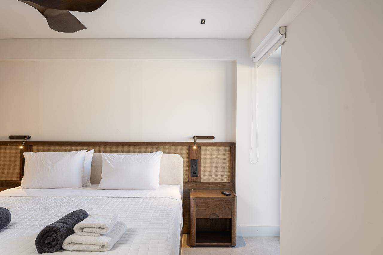 Cane headboard and adjustable reading lights
